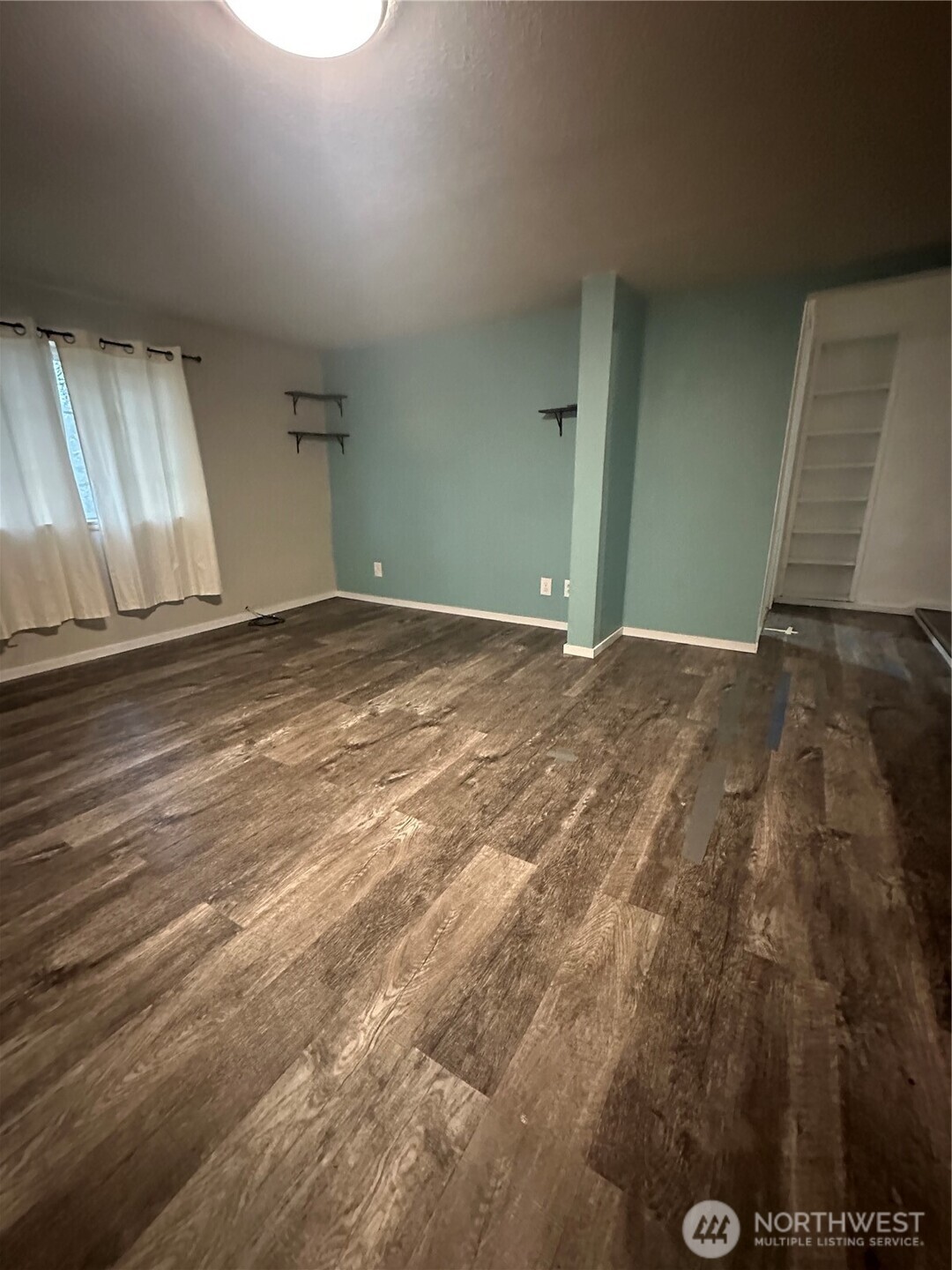 101 Walter Road Winlock, WA 98596 - Photo 17 of 25 a view of empty room with wooden floor