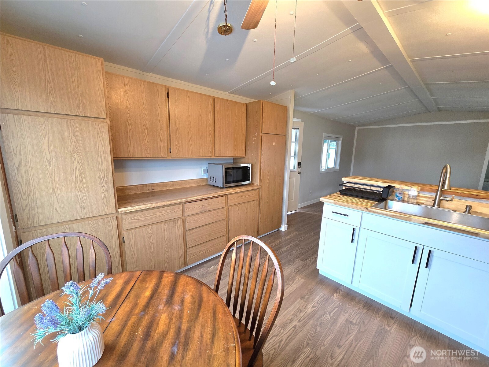 212 Old Owen Road, Unit 43 Sultan, WA 98294 - Photo 14 of 19 a kitchen with stainless steel appliances a sink a microwave a refrigerator and cabinets