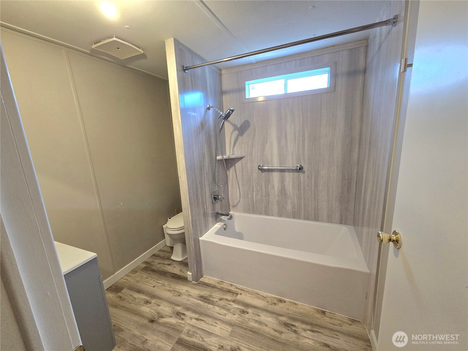 212 Old Owen Road, Unit 43 Sultan, WA 98294 - Photo 17 of 19 a bathroom with a bathtub and a shower