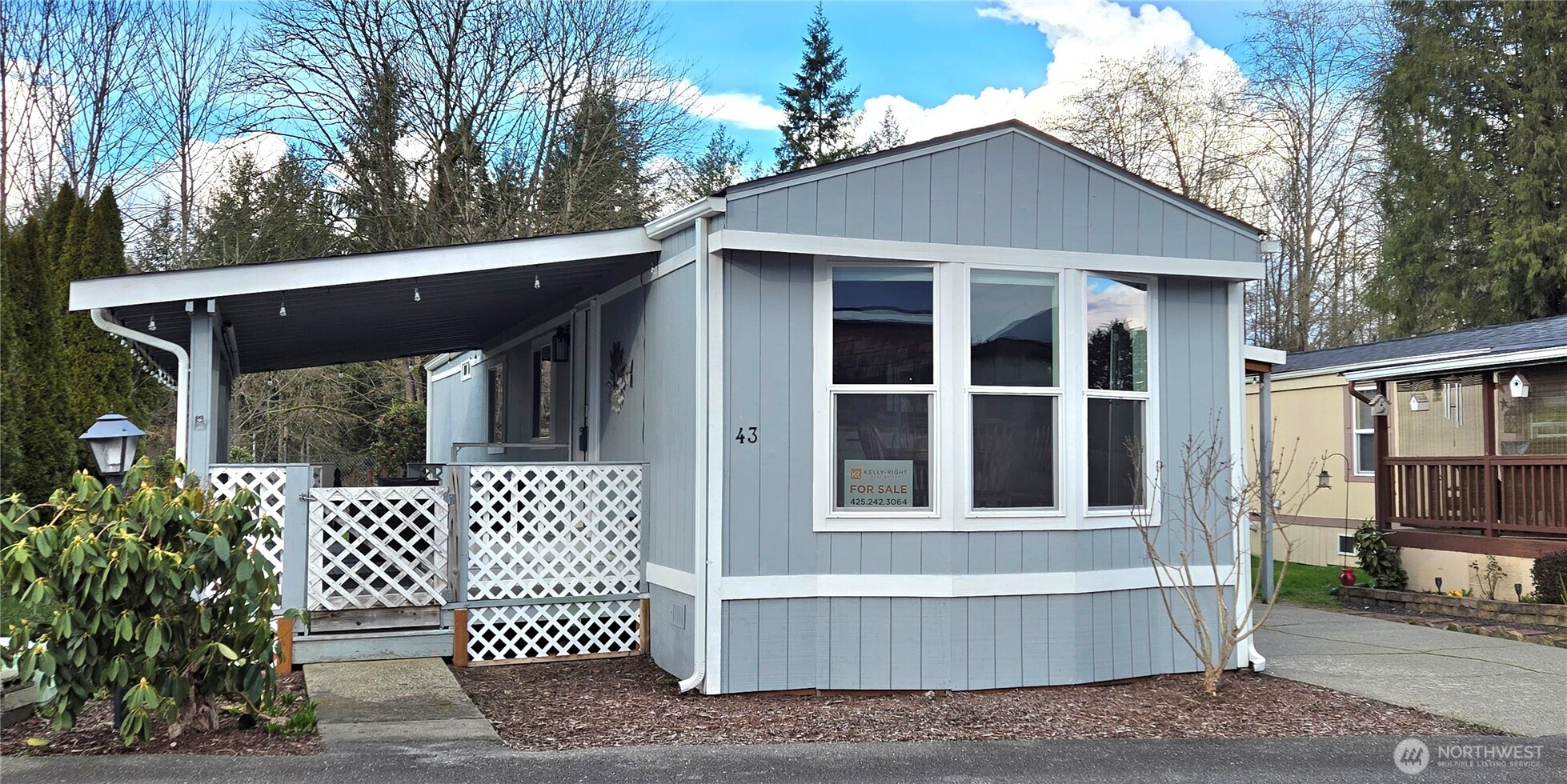 212 Old Owen Road, Unit 43 Sultan, WA 98294 - Photo 2 of 19 a front view of a house with a yard