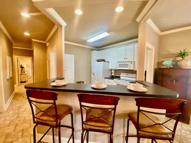 a kitchen with a table and chairs in it