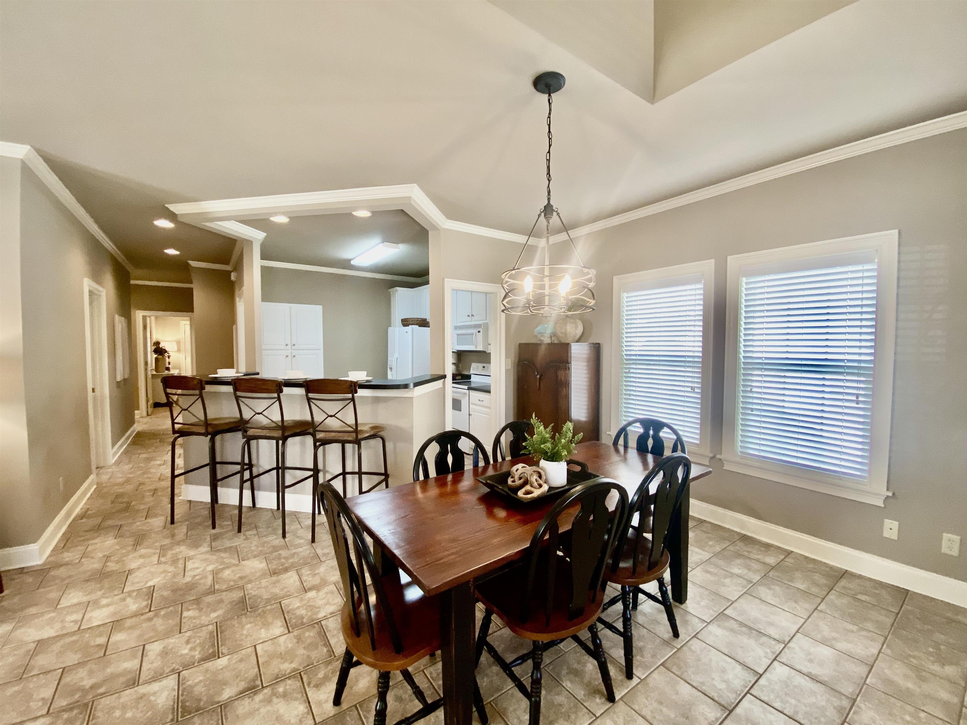 23 Mountain View Iuka, MS 38852 - Photo 15 of 31 a view of a dining room and livingroom with furniture wooden floor a chandelier