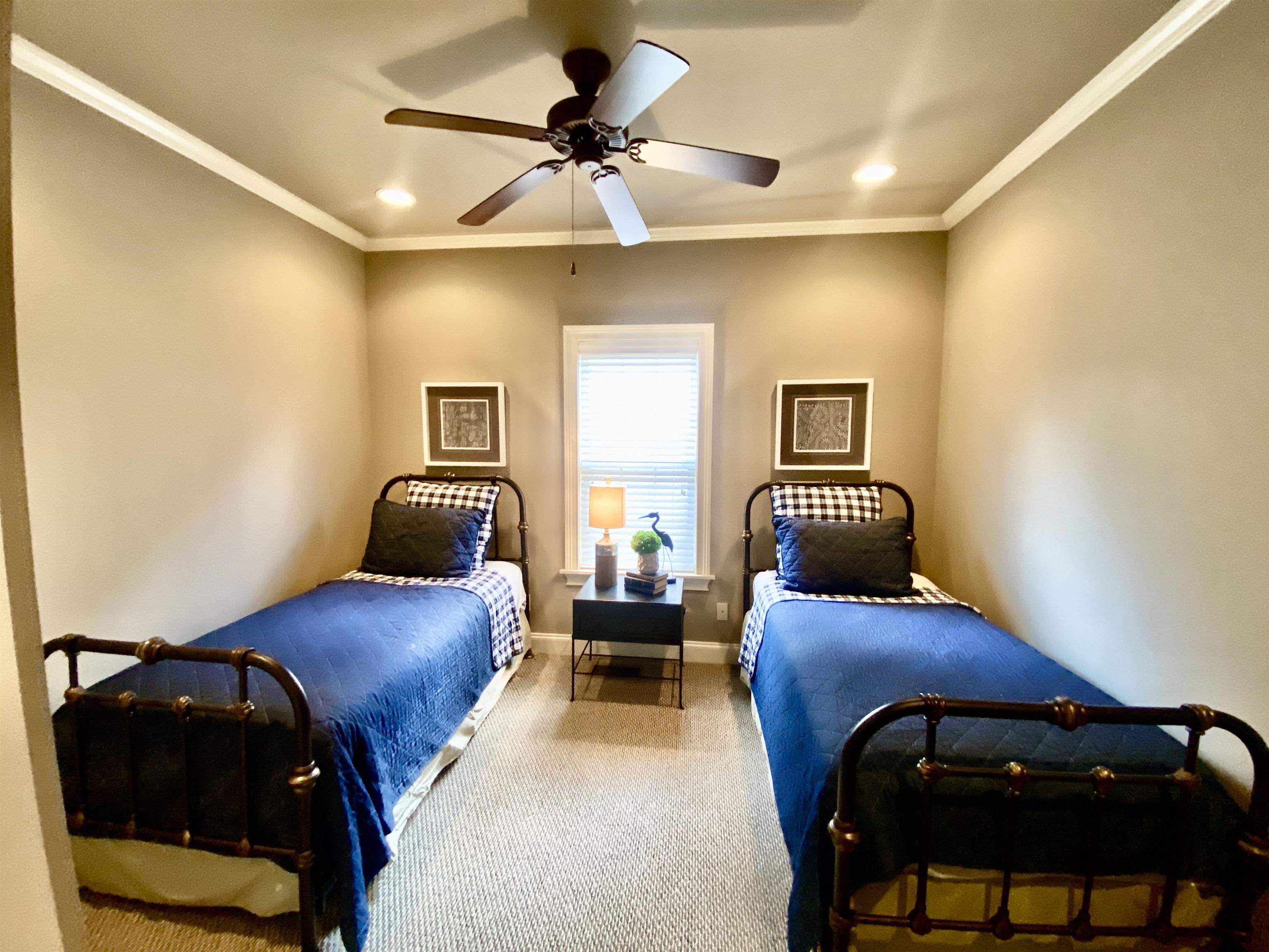 23 Mountain View Iuka, MS 38852 - Photo 22 of 31 a bedroom with a bed and a chandelier