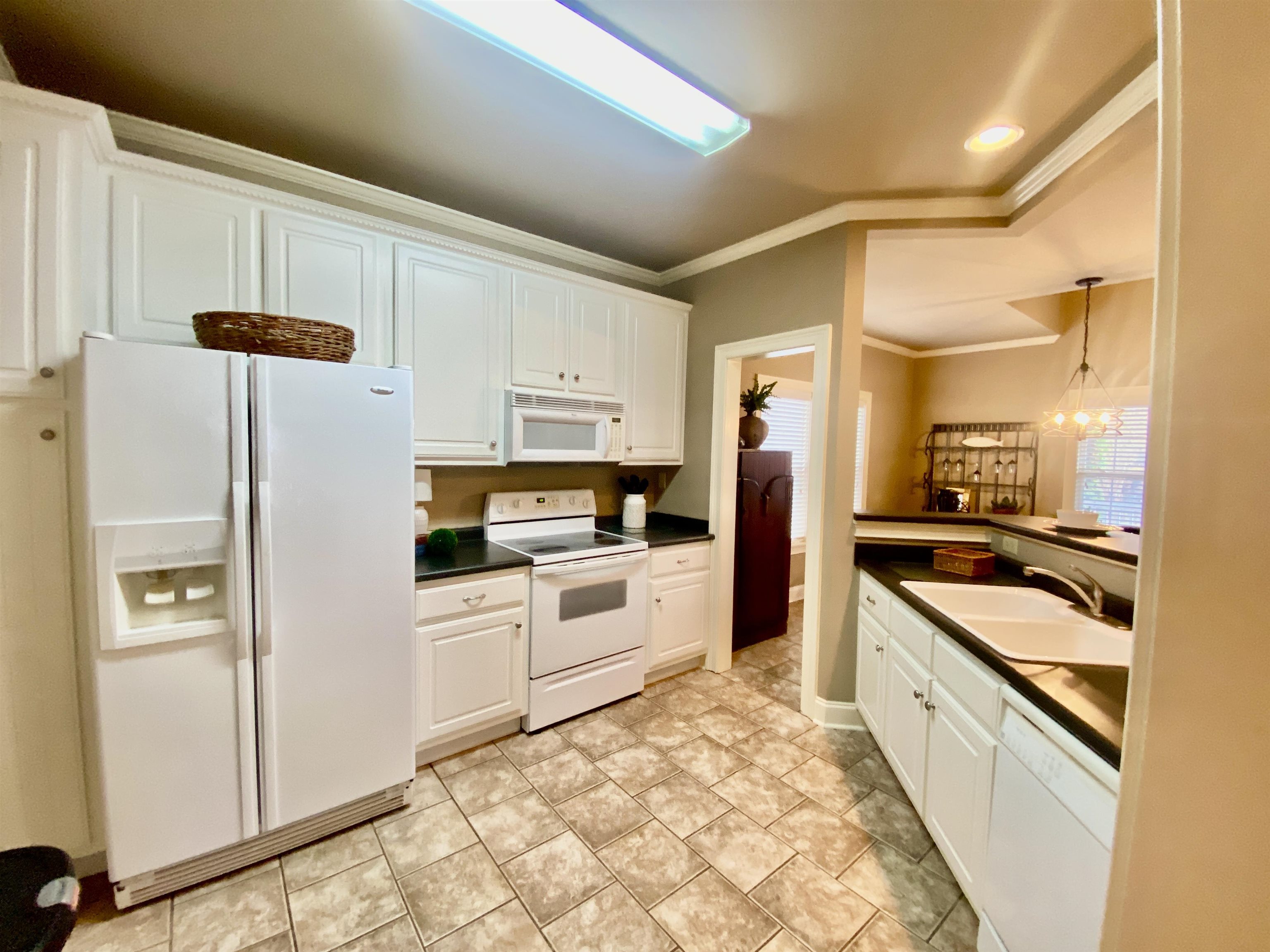 23 Mountain View Iuka, MS 38852 - Photo 9 of 31 a kitchen with stainless steel appliances a refrigerator sink and cabinets