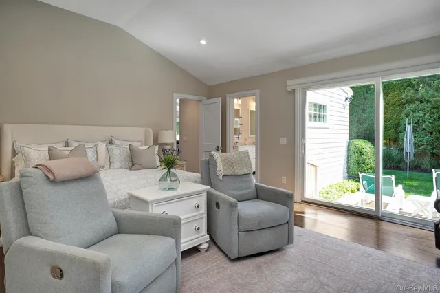 a living room with furniture and a large window with outer view