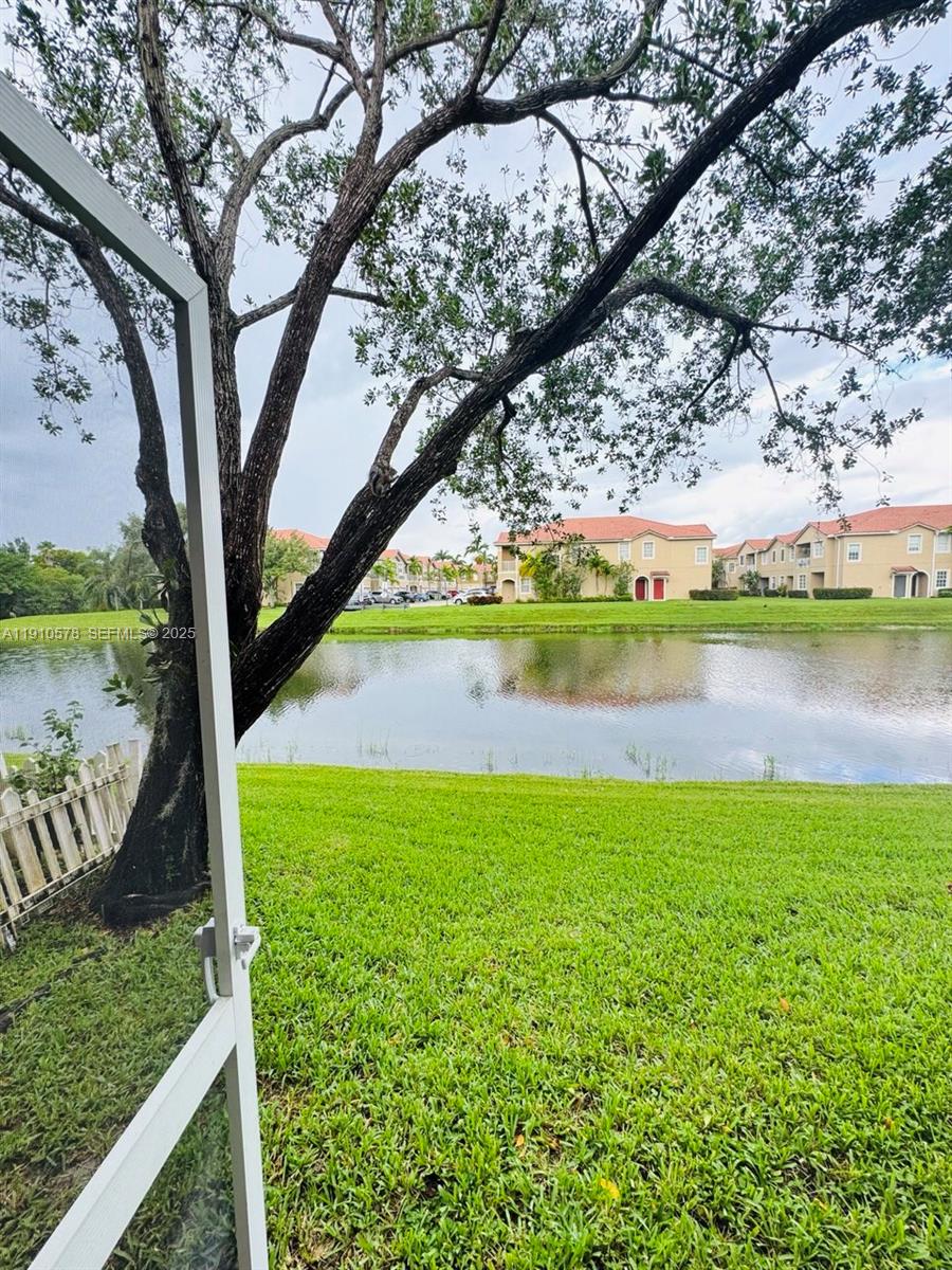 5753 Isles Circle Tamarac, FL 33321 - Photo 11 of 13 a view of a yard with an outdoor seating