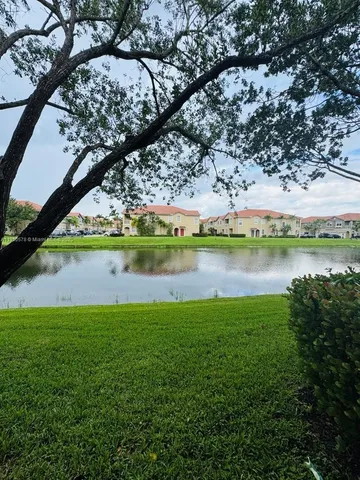 a view of a lake with a big yard