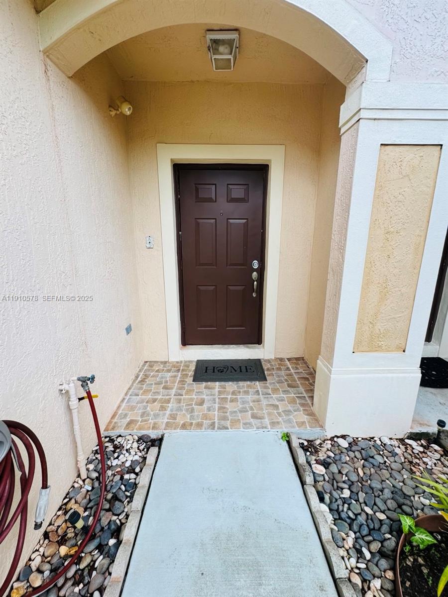 5753 Isles Circle Tamarac, FL 33321 - Photo 2 of 13 a view of a entryway door of the house