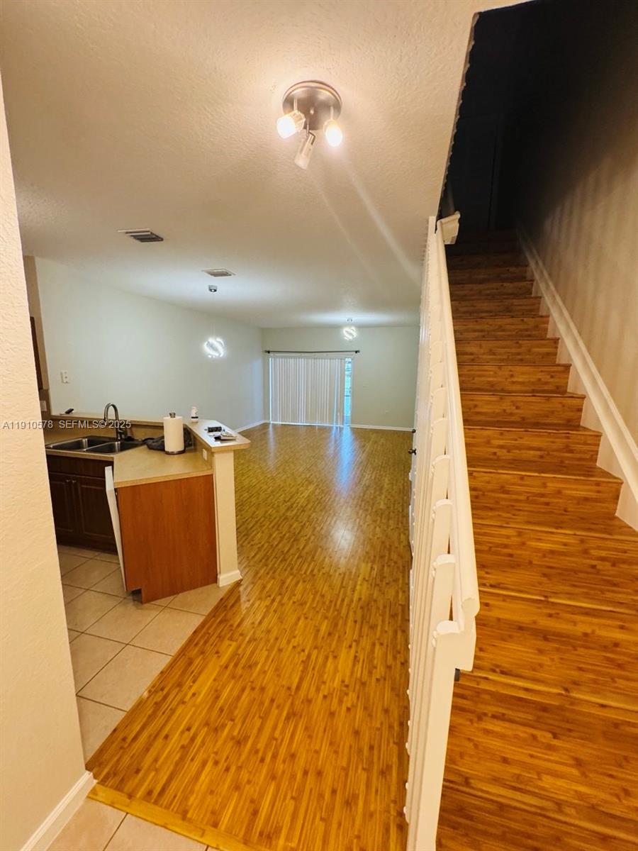 5753 Isles Circle Tamarac, FL 33321 - Photo 3 of 13 a view of a living room with wooden floor