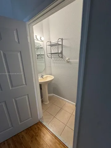 a bathroom with a sink and toilet
