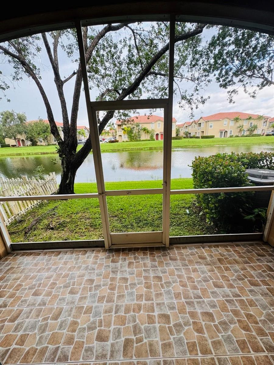 5753 Isles Circle Tamarac, FL 33321 - Photo 10 of 13 a view of a garden with a bench in the patio