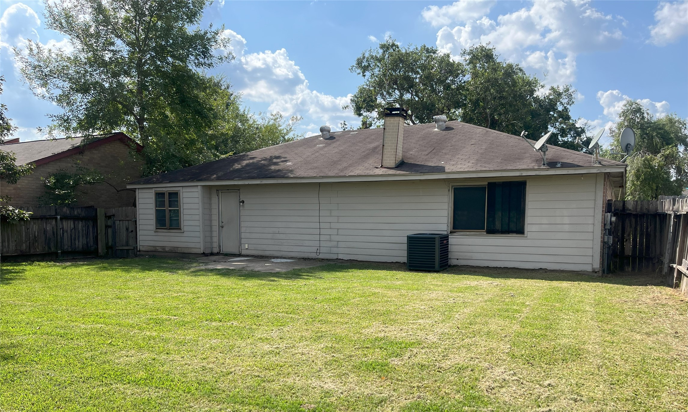 14874 Easingwold Drive Houston, TX 77015 - Photo 12 of 13 a view of a house with a yard and a large tree