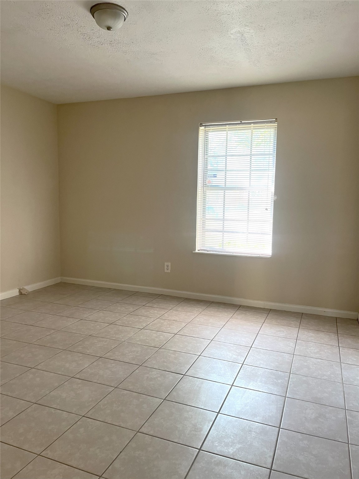 14874 Easingwold Drive Houston, TX 77015 - Photo 9 of 13 an empty room with a window