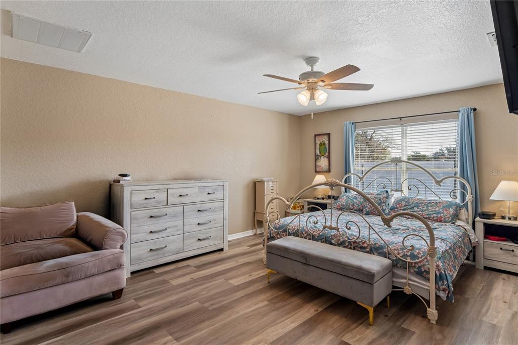 10318 Gifford Drive Spring Hill, FL 34608 - Photo 24 of 57 a bedroom with furniture and a couch
