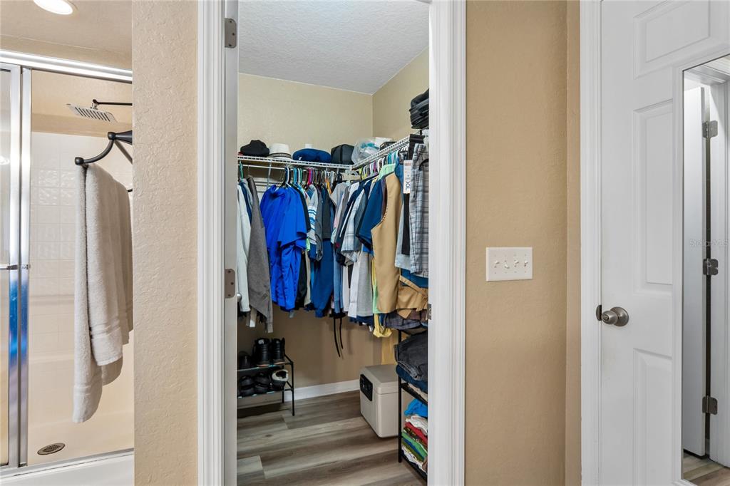 10318 Gifford Drive Spring Hill, FL 34608 - Photo 30 of 57 a view of walk in closet with clothes