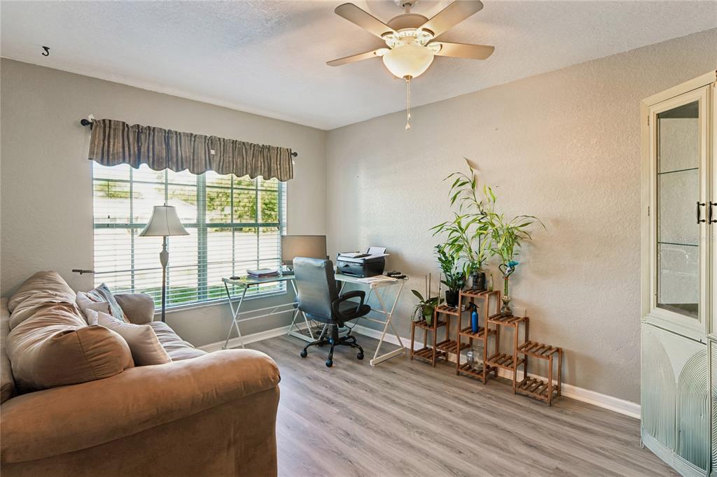 10318 Gifford Drive Spring Hill, FL 34608 - Photo 32 of 57 a living room with furniture and a large window