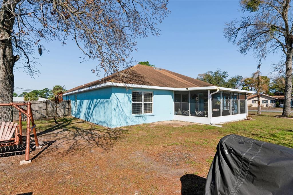 10318 Gifford Drive Spring Hill, FL 34608 - Photo 44 of 57 a view of a house with a yard