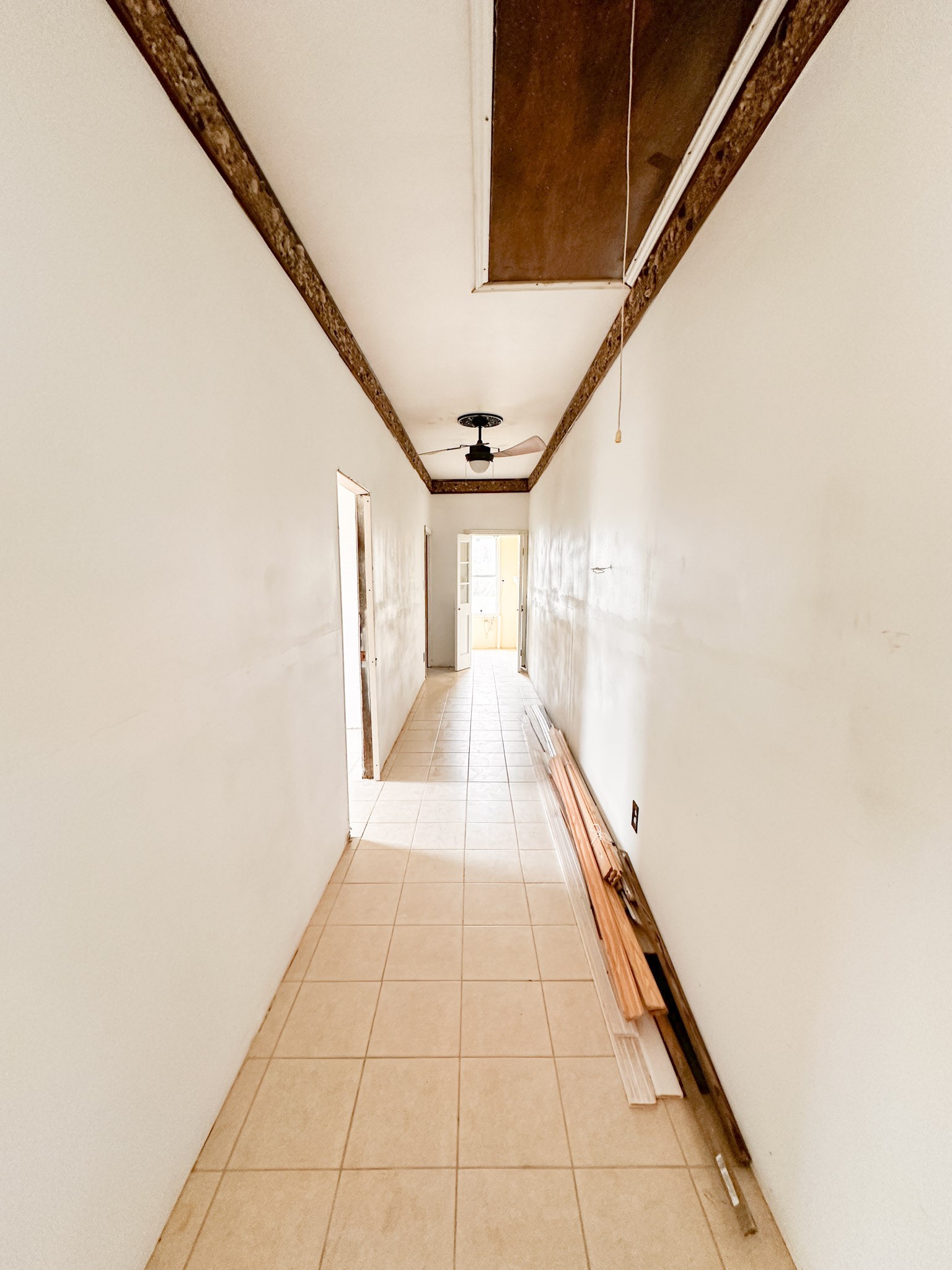 638 Kelly Lane Angleton, TX 77515 - Photo 12 of 21 a hallway with a large window and potted plants