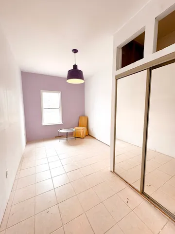 a view of an empty room and window