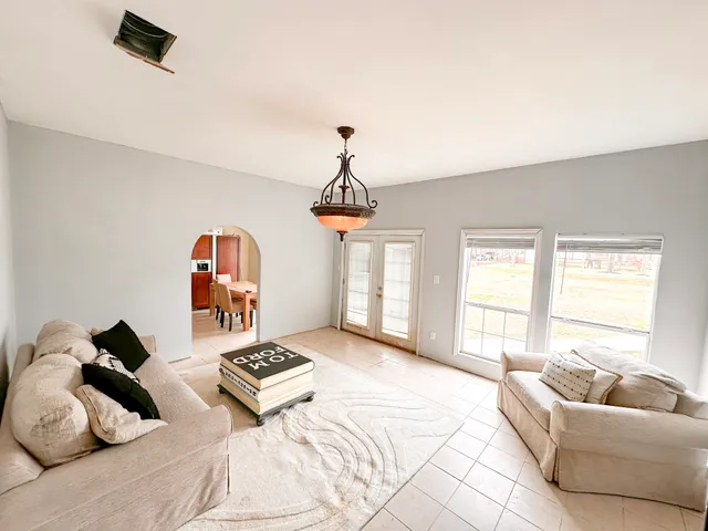 a bedroom with furniture and a window
