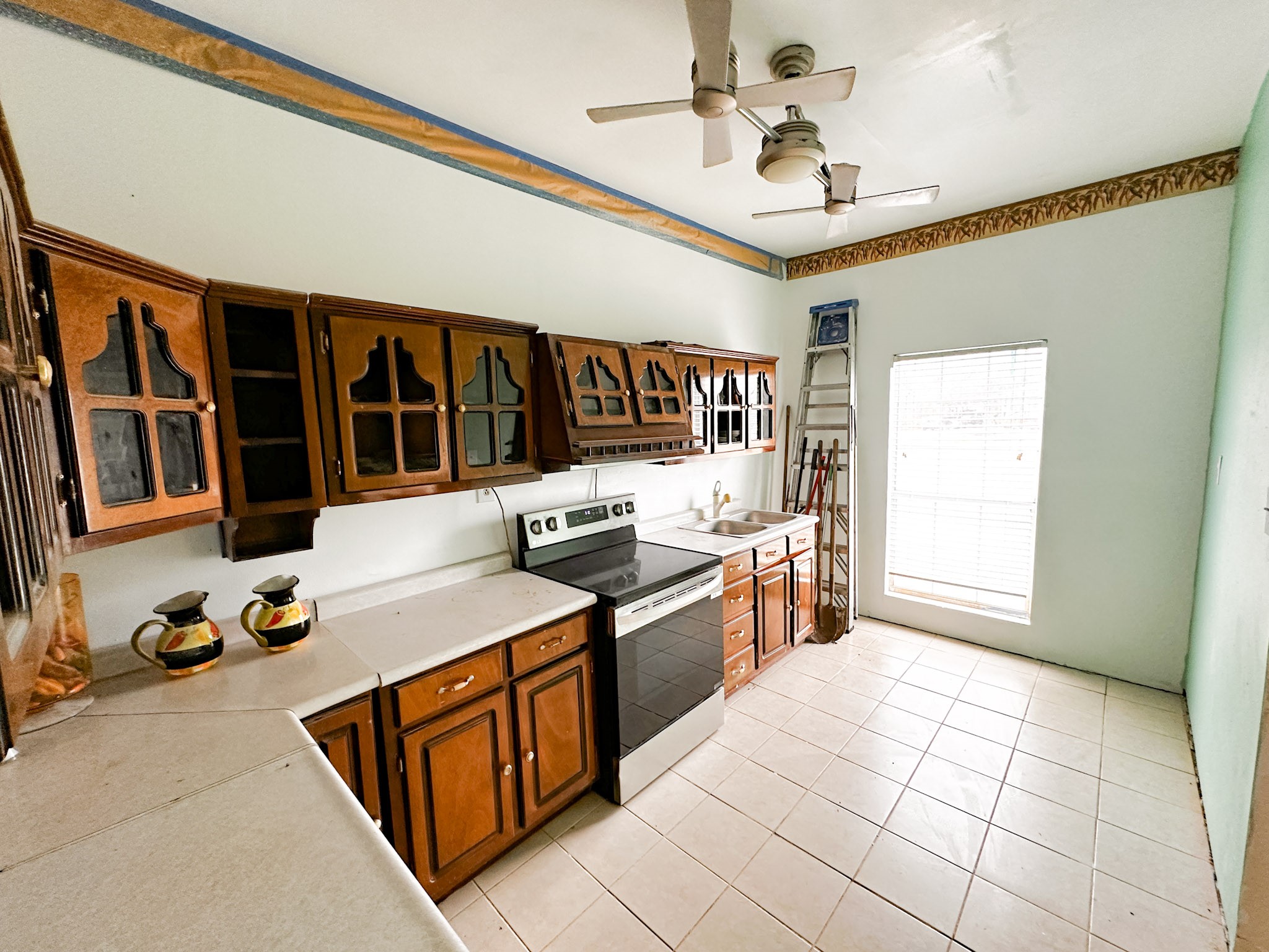 638 Kelly Lane Angleton, TX 77515 - Photo 8 of 21 a kitchen that has a lot of cabinets in it