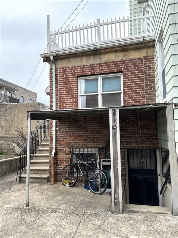 1334 66th Street Brooklyn, NY 11219 - Photo 14 of 15 a front view of a house with many windows