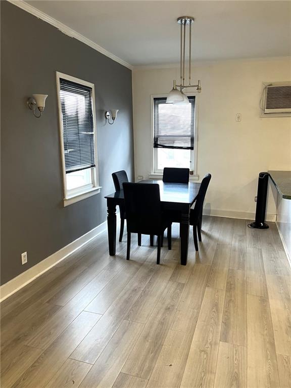 1334 66th Street Brooklyn, NY 11219 - Photo 4 of 15 a dining room with furniture and wooden floor