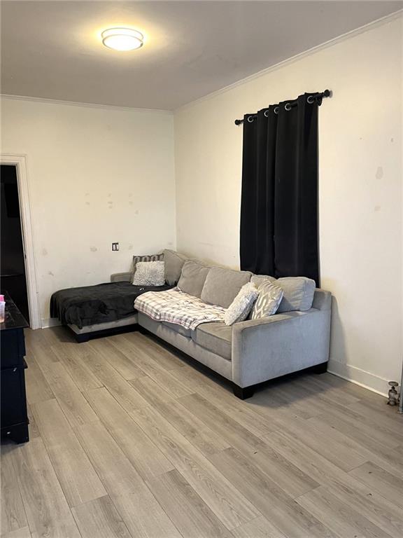 1334 66th Street Brooklyn, NY 11219 - Photo 5 of 15 a living room with couches and a flat screen tv