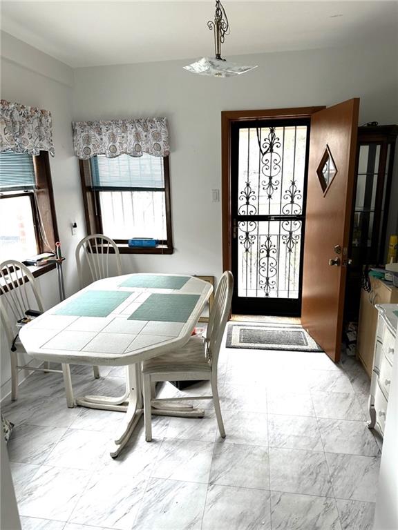 1334 66th Street Brooklyn, NY 11219 - Photo 7 of 15 a room with furniture pool table flat screen tv and windows