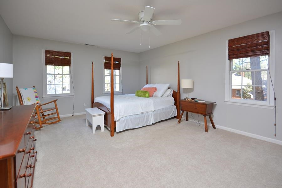 108 Rother Lane Durham, NC 27707 - Photo 20 of 34 a bedroom with bed and a window