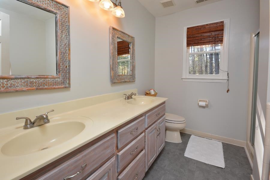 108 Rother Lane Durham, NC 27707 - Photo 21 of 34 a bathroom with a sink and a toilet