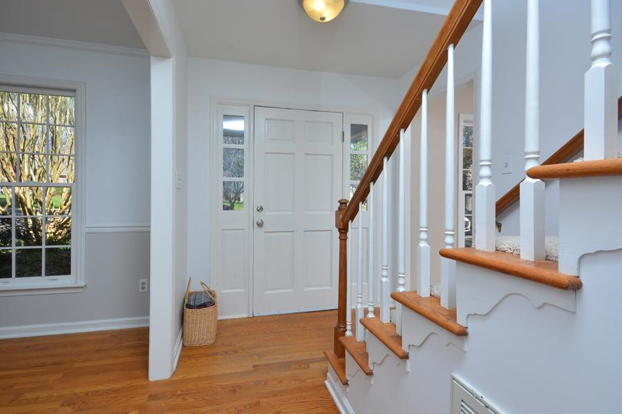 108 Rother Lane Durham, NC 27707 - Photo 4 of 34 a view of entryway with wooden floor and stairs
