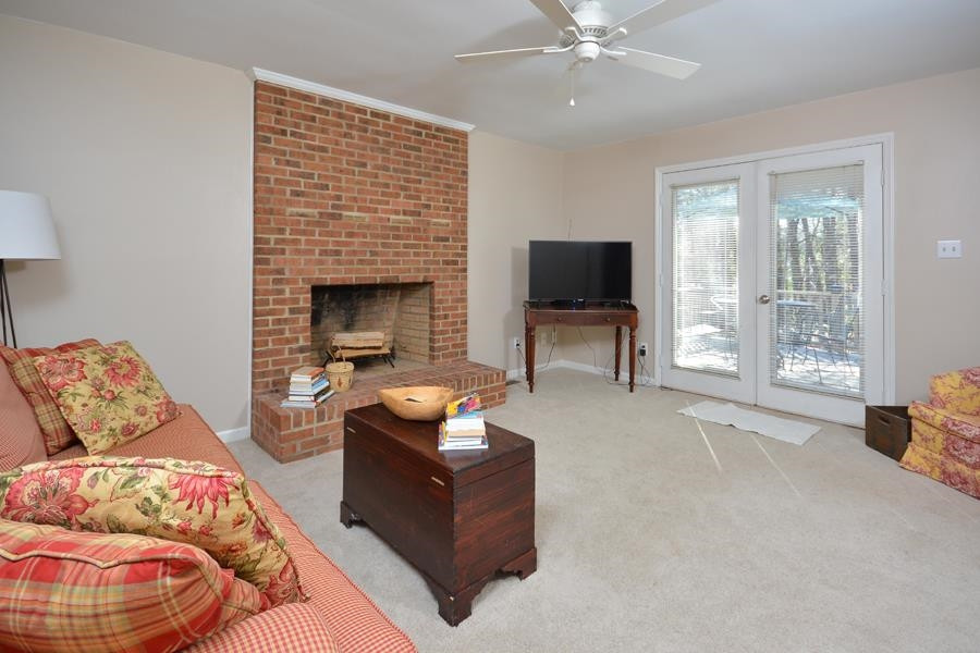 108 Rother Lane Durham, NC 27707 - Photo 8 of 34 a living room with furniture and a fireplace