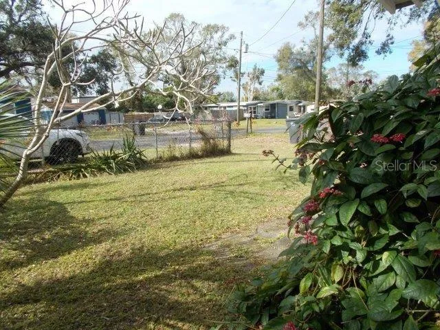 a kitchen with a sink a stove and cabinets