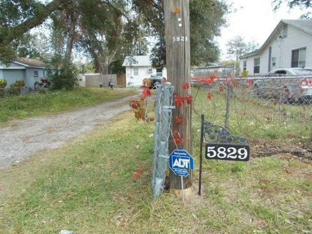 a bedroom with a bed window and a chandelier