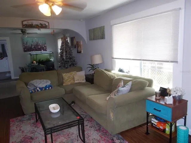 a view of a livingroom with furniture and a chandelier