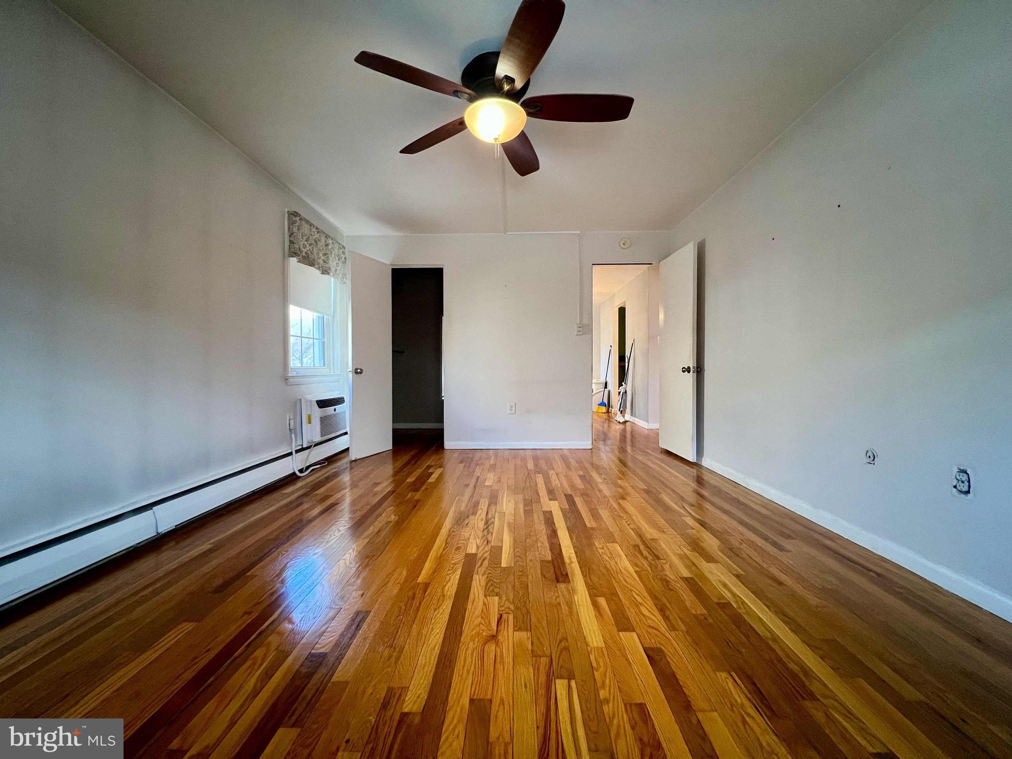 175 West King Street, Unit 107 Malvern, PA 19355 - Photo 15 of 27 a view of empty room with wooden floor