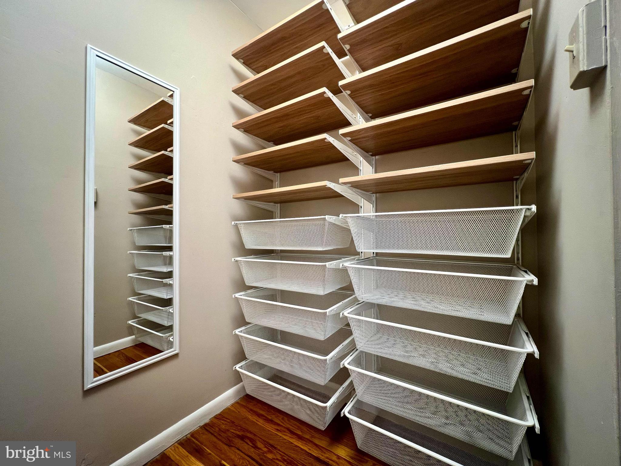 175 West King Street, Unit 107 Malvern, PA 19355 - Photo 16 of 27 a view of walk in closet with empty racks