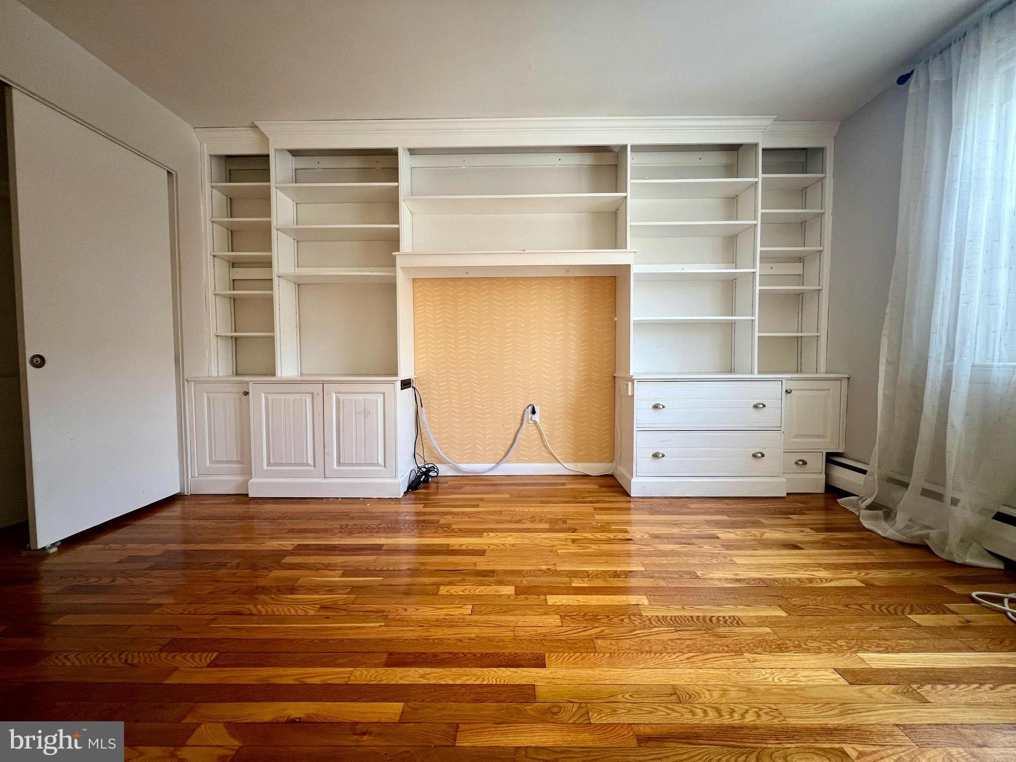 175 West King Street, Unit 107 Malvern, PA 19355 - Photo 20 of 27 a view of empty room with cabinet and window