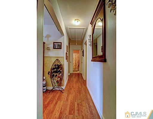 22 Sanders Road Edison, NJ 08817 - Photo 13 of 25 a view of hallway with wooden floor