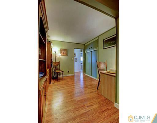 22 Sanders Road Edison, NJ 08817 - Photo 15 of 25 a view of living room with furniture and wooden floor