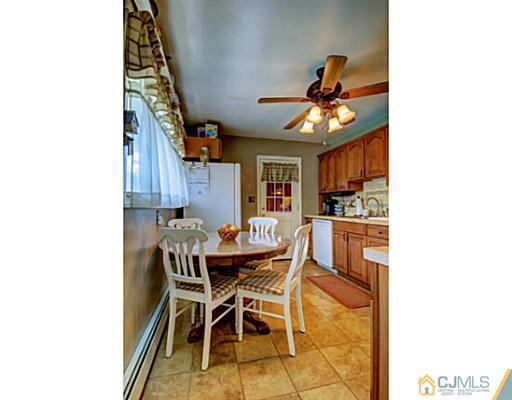 22 Sanders Road Edison, NJ 08817 - Photo 8 of 25 a dining room with furniture and window