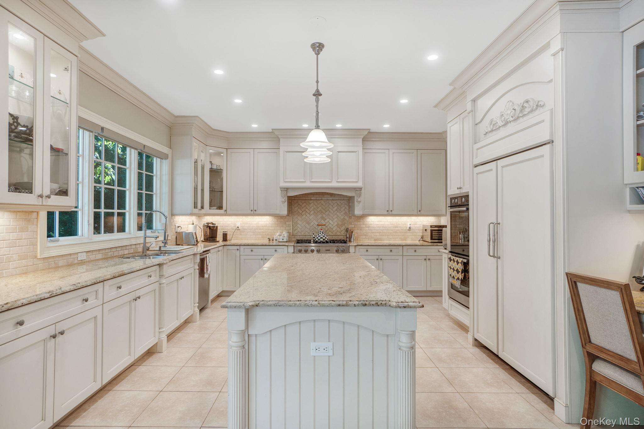 1 Norgate Road Glen Head, NY 11545 - Photo 15 of 42 a large kitchen with kitchen island granite countertop lots of counter space a sink appliances and cabinets