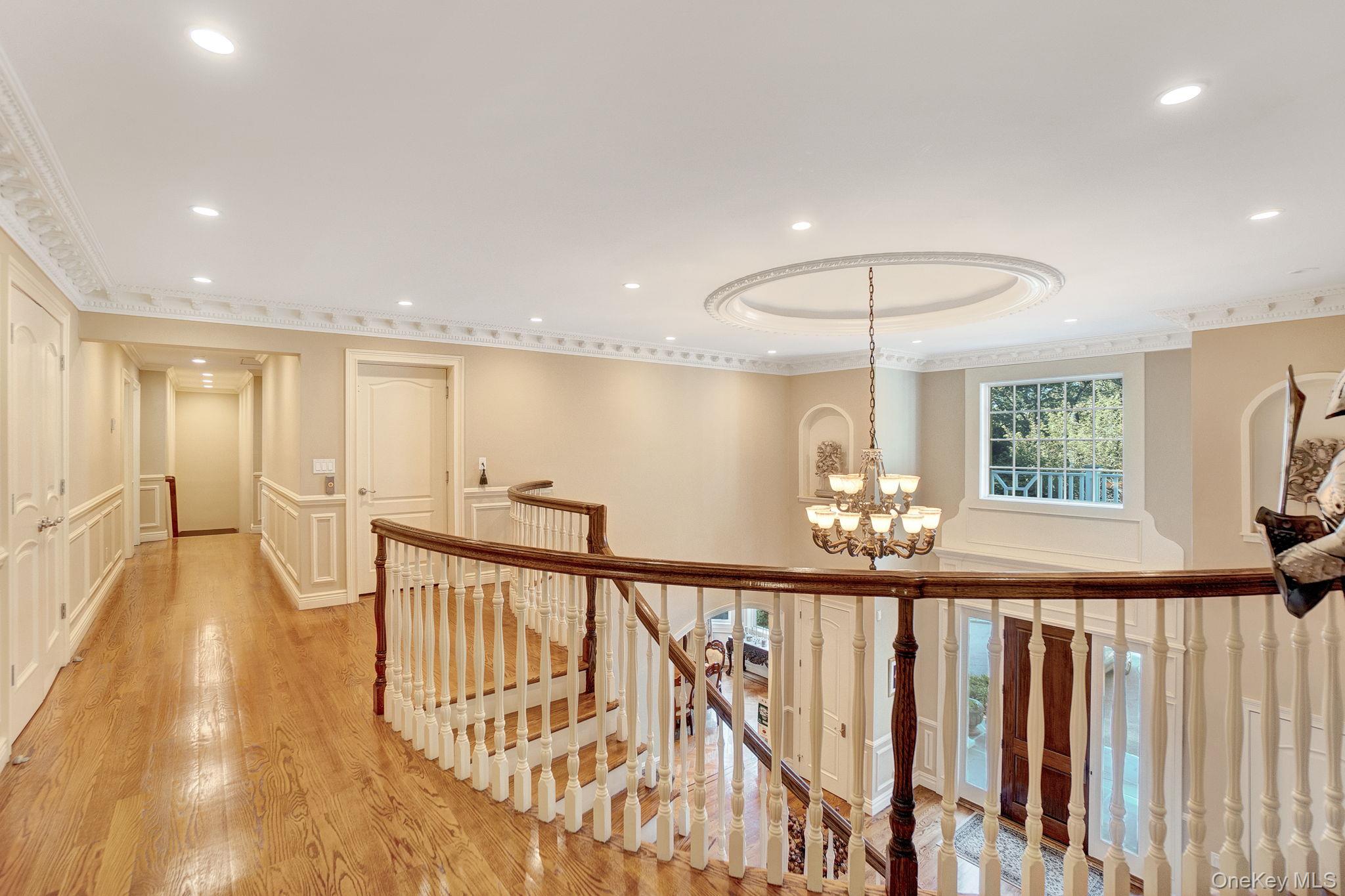 1 Norgate Road Glen Head, NY 11545 - Photo 19 of 42 a view of a room with wooden floor and stairs
