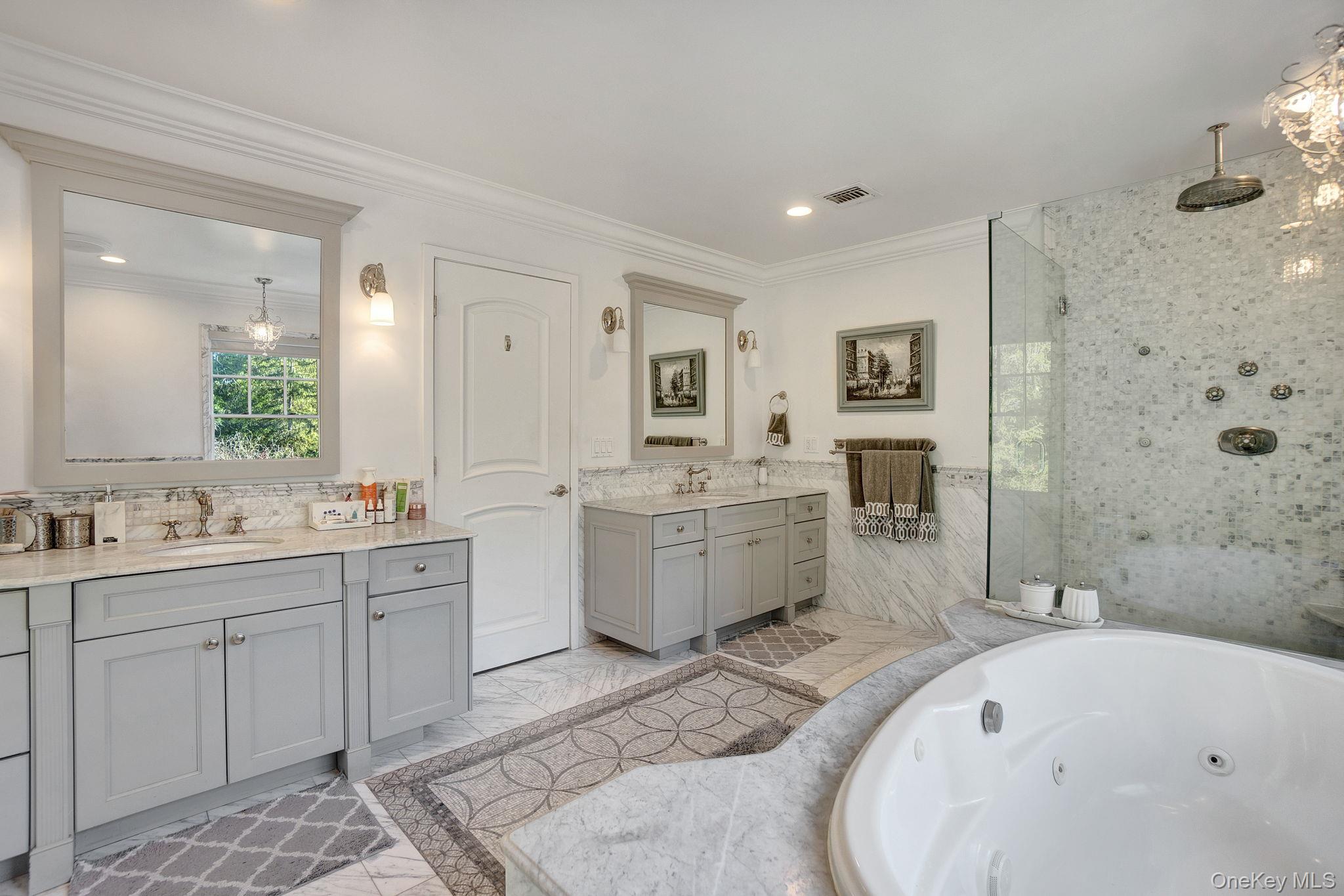 1 Norgate Road Glen Head, NY 11545 - Photo 23 of 42 a large bathroom with a tub sink toilet and mirror