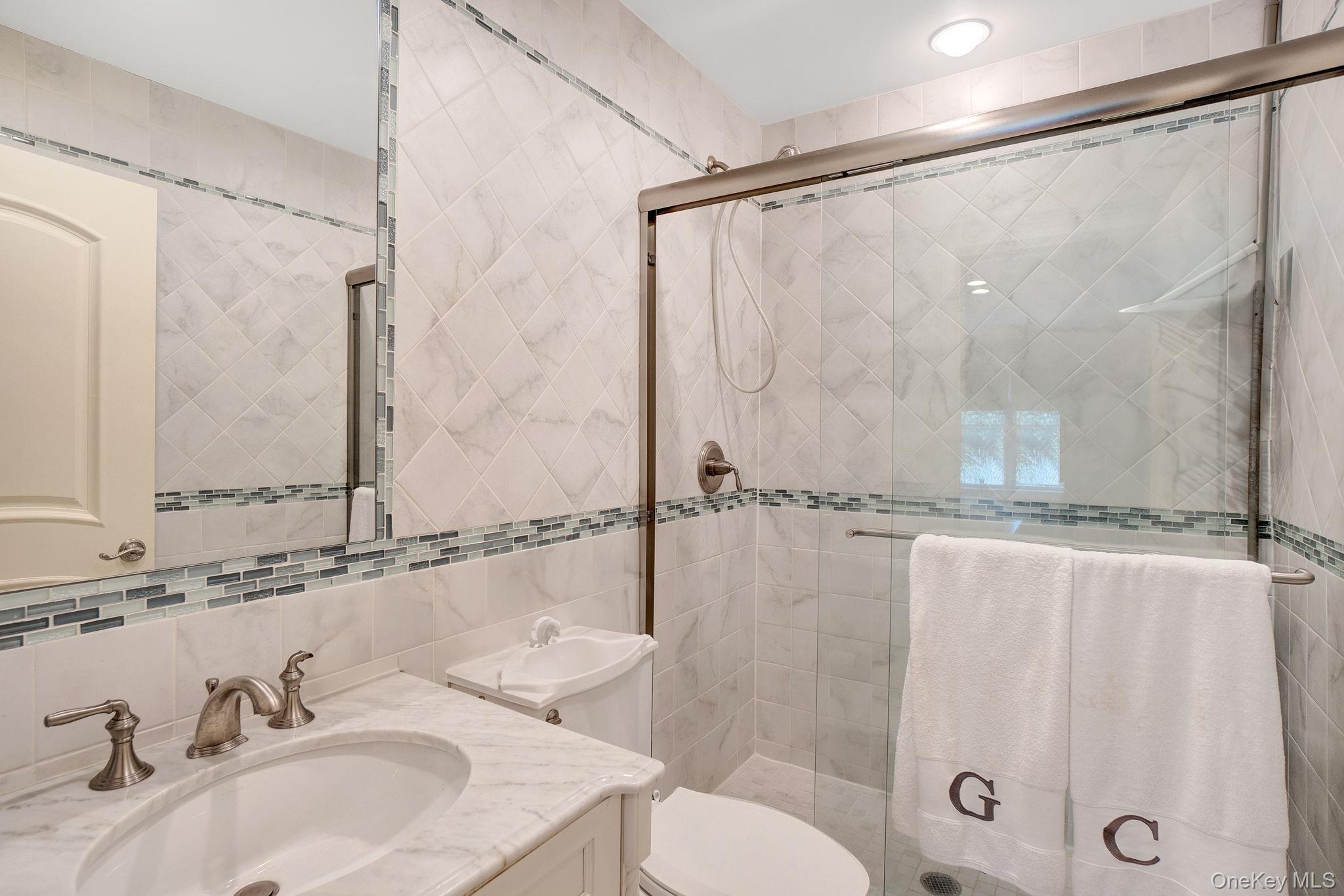 1 Norgate Road Glen Head, NY 11545 - Photo 26 of 42 a bathroom with a sink and a mirror