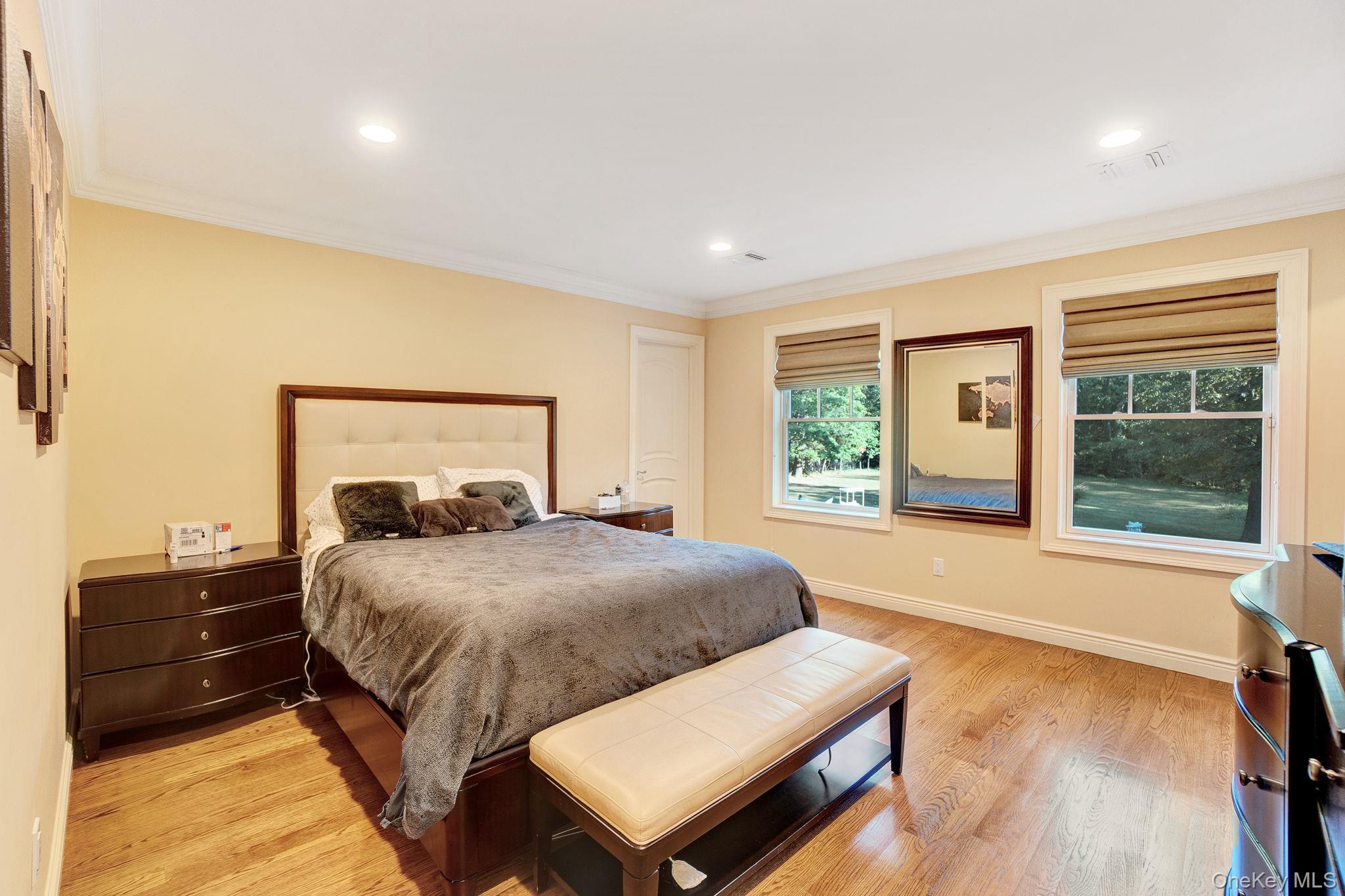 1 Norgate Road Glen Head, NY 11545 - Photo 27 of 42 a bedroom with a large bed and a window