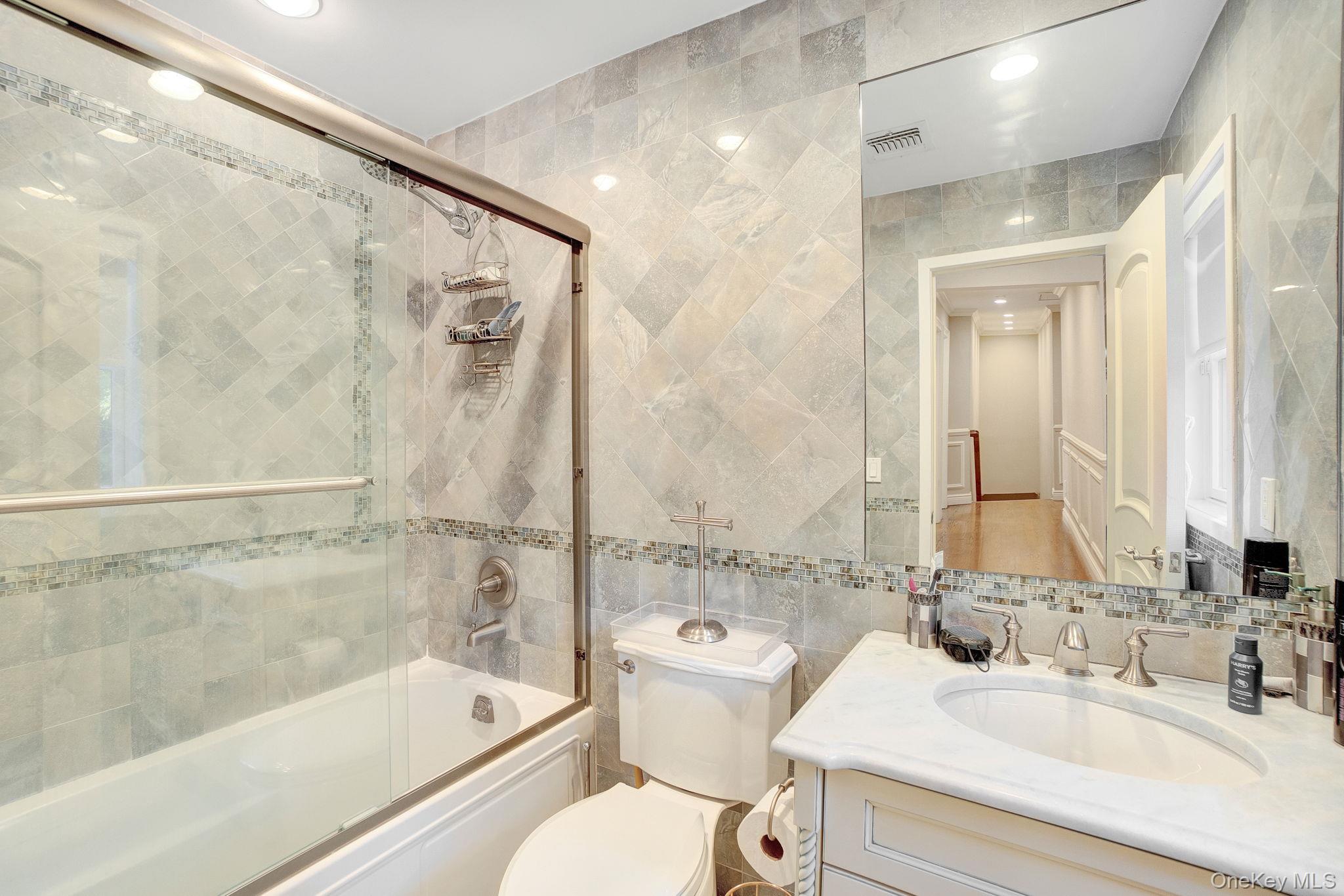 1 Norgate Road Glen Head, NY 11545 - Photo 28 of 42 a bathroom with a sink toilet and shower