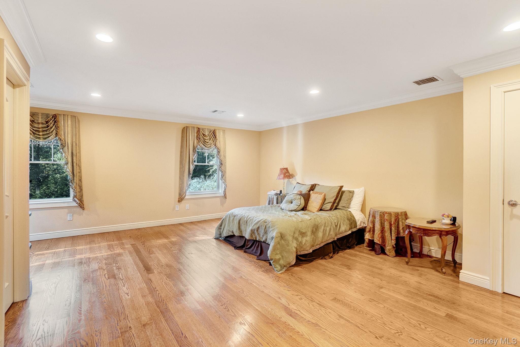 1 Norgate Road Glen Head, NY 11545 - Photo 31 of 42 a spacious bedroom with a large bed and a window