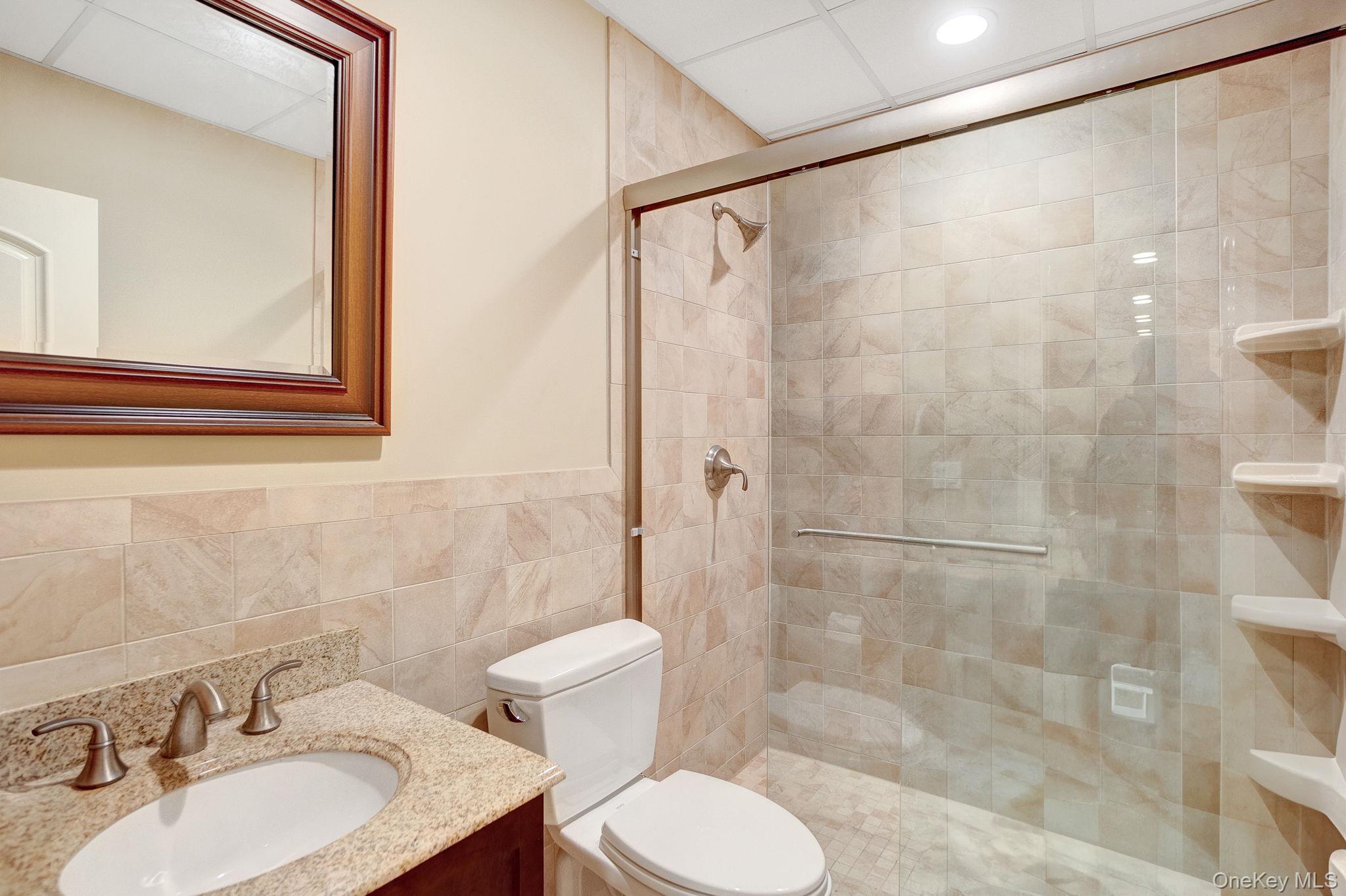 1 Norgate Road Glen Head, NY 11545 - Photo 35 of 42 a bathroom with a sink toilet and shower